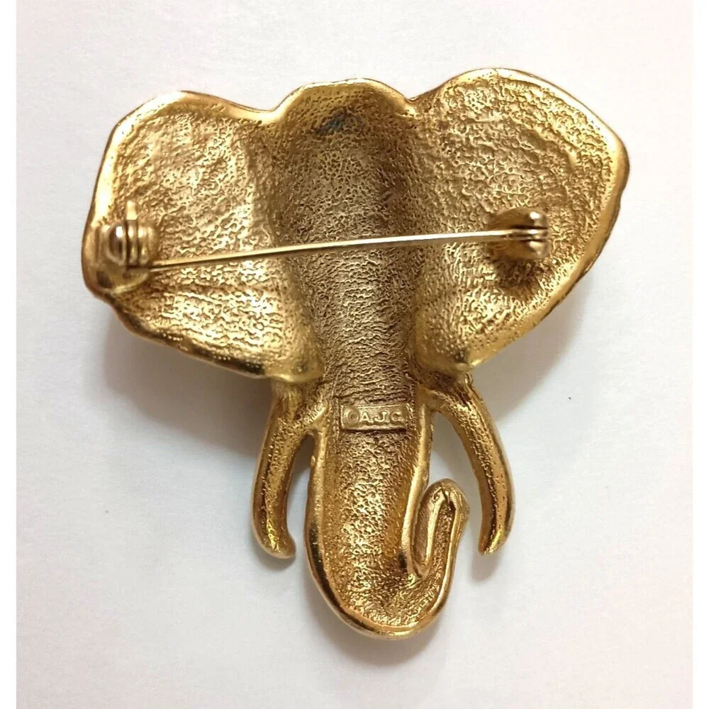 AJC Elephant Head Brooch Signed Gold Tone Faux Ivory Tusks Vintage Statement